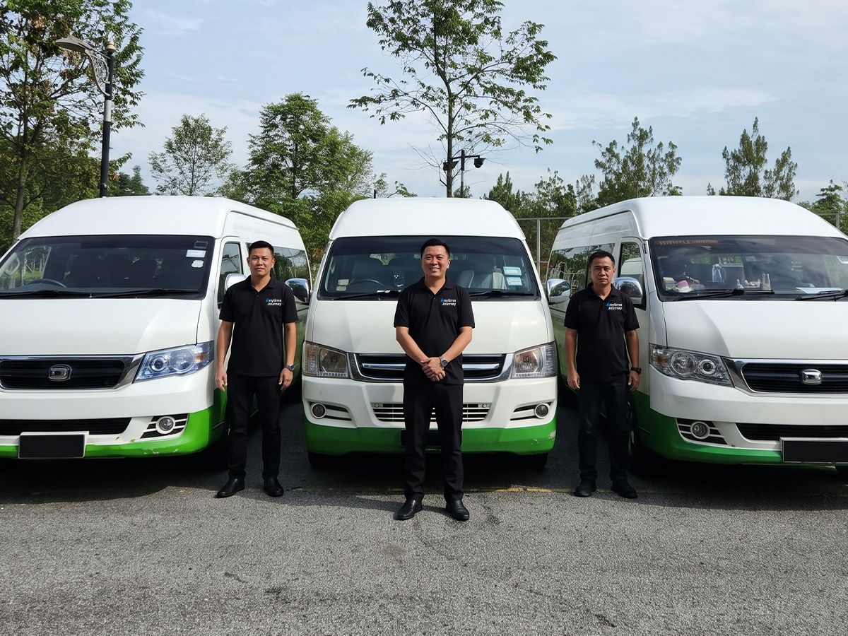 Anytime Journey charter van on a Malaysian road